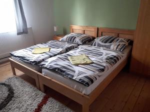 Postel nebo postele na pokoji v ubytování Penzion Na Střelnici