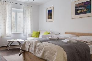Posteľ alebo postele v izbe v ubytovaní Apartament urokliwa Długa