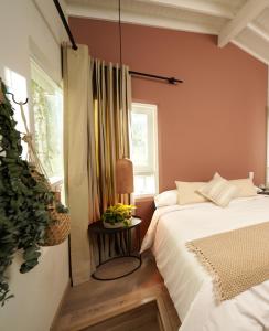 Postel nebo postele na pokoji v ubytování Hotel Quinta Ladera