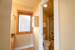 a bathroom with a toilet and a window at Breakaway West - Studio, 2,3 Bedrooms by Vail Realty in Vail