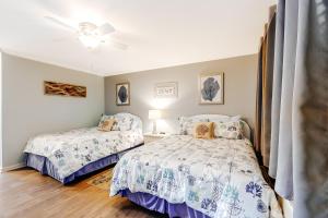 a bedroom with two beds and a ceiling fan at Harbor Breeze 58 in Ocean City