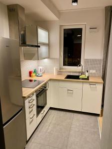 A kitchen or kitchenette at Panoramic view apartments Warsaw West II