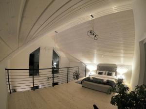 a master bedroom with a bed and a balcony at ŚNIEŻKA HOUSE in Mysłakowice +65 photos