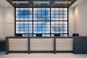 a large desk in an office with a large window at Waikiki Malia in Honolulu