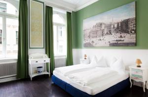 Postel nebo postele na pokoji v ubytování Boutique Hotel Columbia