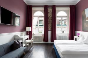 Postel nebo postele na pokoji v ubytování Boutique Hotel Columbia