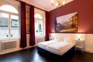 Postel nebo postele na pokoji v ubytování Boutique Hotel Columbia