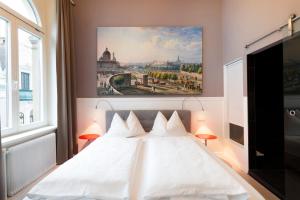 Postel nebo postele na pokoji v ubytování Boutique Hotel Columbia