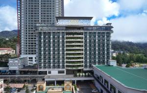 a large building with a gold sign on it at GEO RESORT & HOTEL in Genting Highlands