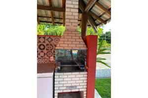 an outdoor brick oven in a house at Ecoville das Mangueiras - Condomínio em Monte Gordo - Região de Guarajuba in Camacari