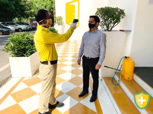 a man wearing a mask standing next to a man at X by Bloom l Manyata in Bangalore