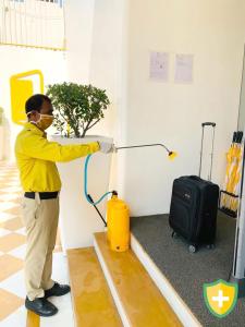 a man in a room with a hose at X by Bloom l Manyata in Bangalore