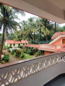 a view from the balcony of a house at Hotel Siesta De Goa in Varca