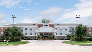a rendering of the front of a hotel at Holiday Inn Express Hotel and Suites Conroe by IHG in Conroe