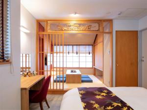 Rúm í herbergi á Tanakaya Kyoto Karasuma