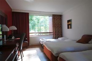 Ліжко або ліжка в номері Finlandia Hotel Isovalkeinen