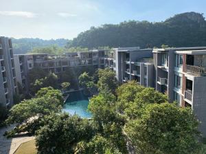 an aerial view of an apartment complex with a pool at The Valley Khao Yai in Ban Huai Sok Noi