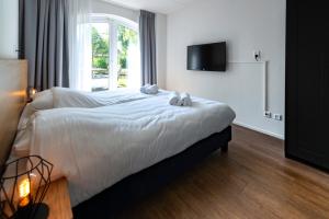 Llit o llits en una habitació de Resort Citta Romana