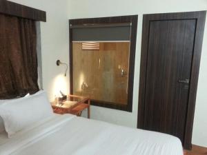 Adamo the Resort客房内的一张或多张床位