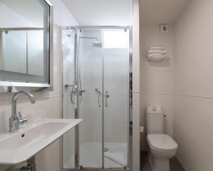 a bathroom with a shower and a sink and a toilet at Napoleon in Ajaccio