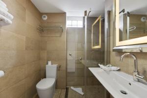 a bathroom with a toilet and a sink at Napoleon in Ajaccio