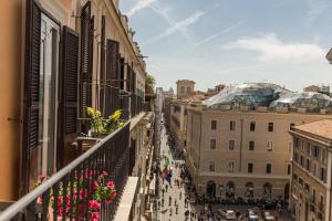 a view of a city street from a balcony at Hotel 55 Fifty-Five - Maison d'Art Collection in Rome