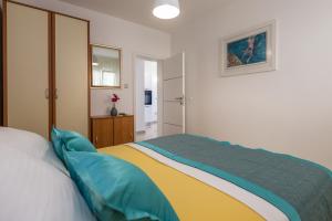 Posteľ alebo postele v izbe v ubytovaní Holiday House ALMISSA