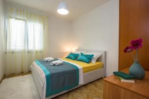 Posteľ alebo postele v izbe v ubytovaní Holiday House ALMISSA