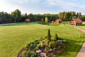an aerial view of a yard with cottages at Vila Karališkis in Karališkiai
