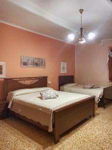 Posteľ alebo postele v izbe v ubytovaní La Casa dei Nonni