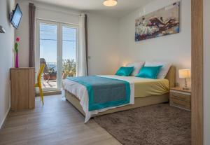 Posteľ alebo postele v izbe v ubytovaní Holiday House ALMISSA