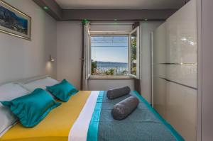 Posteľ alebo postele v izbe v ubytovaní Holiday House ALMISSA
