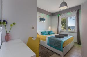 Posteľ alebo postele v izbe v ubytovaní Holiday House ALMISSA