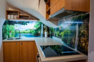 an aquarium in the kitchen of a house at POČITNIŠKI APARTMAJI - Sunny apartment in Moravske Toplice in Moravske-Toplice