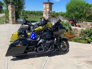 a black motorcycle parked in a driveway at Massoni Bed and Breakfast in Peschiera del Garda