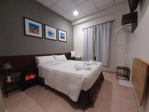 a bedroom with a bed and a fire place at CH Murallas II in Madrid