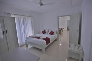 Säng eller sängar i ett rum på Jyothis Retreat