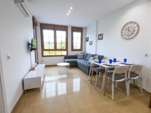 a living room with a couch and a table at Apartamento Altea Blanca in Altea