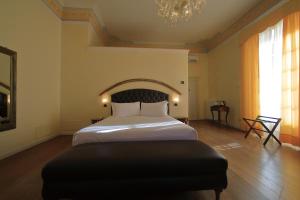 a hotel room with a bed and a fireplace at Classique in Lazise