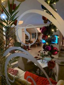 a living room with a christmas tree and a couch at Hi Boutique Hotel in Varna City