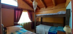 Ein Etagenbett oder Etagenbetten in einem Zimmer der Unterkunft Casa Amanecer Vichuquén
