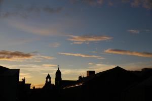 a silhouette of a city with the sky in the background at Kings Lodge - Grampian Lettings Ltd in Aberdeen