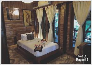 Cama ou camas em um quarto em Viking Nature Resort