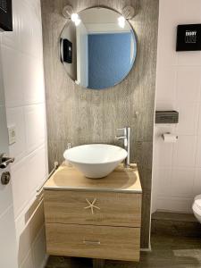 a bathroom with a sink and a mirror at Málaga Beach and Historic centre Malagueta in Málaga