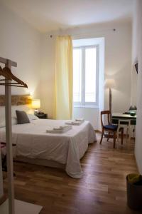 A bed or beds in a room at Albergo delle Spezie