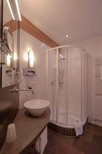 a bathroom with a sink, toilet and bathtub at Schindler in Sankt Anton am Arlberg
