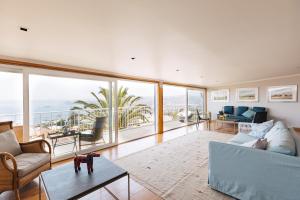 a living room with a view of the ocean at Casablu Hotel in Valparaíso