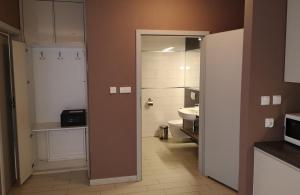 a bathroom with a sink and a toilet in a room at Apartament Czarna Góra NATALIA in Stronie Śląskie