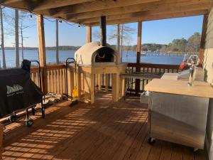 a porch with an outdoor oven on a boat at Dances Bay in Elizabeth City