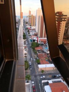 a view of a city street from a building at Magnífico Flat no melhor de Manaíra - Apart Hotel in João Pessoa